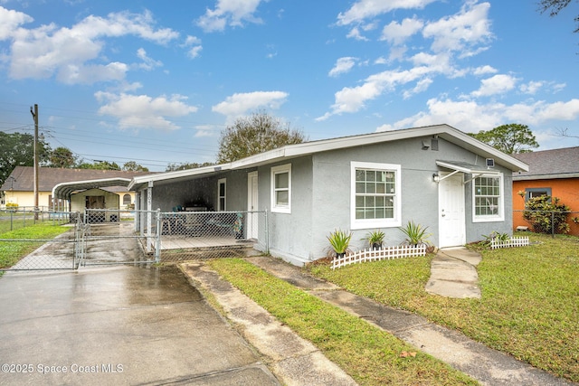 ranch-style house with a front lawn