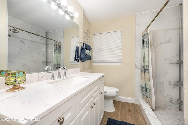 bathroom featuring vanity, curtained shower, wood-type flooring, and toilet