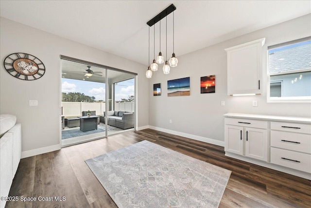 dining space featuring dark hardwood / wood-style floors