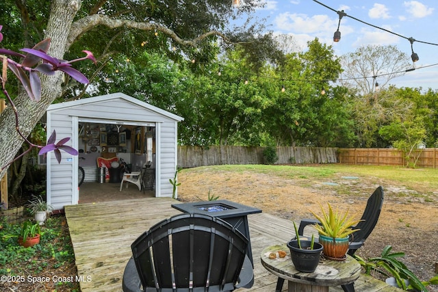 exterior space featuring an outdoor fire pit and a storage unit