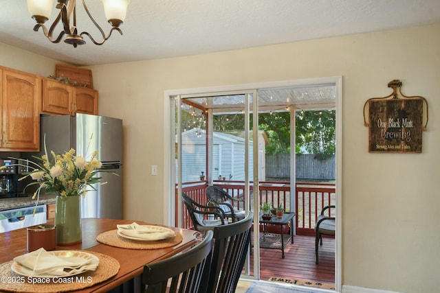 dining area featuring a notable chandelier