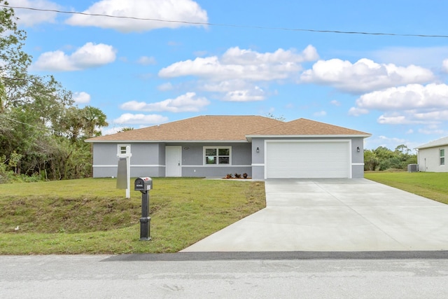 ranch-style house featuring a garage and a front lawn