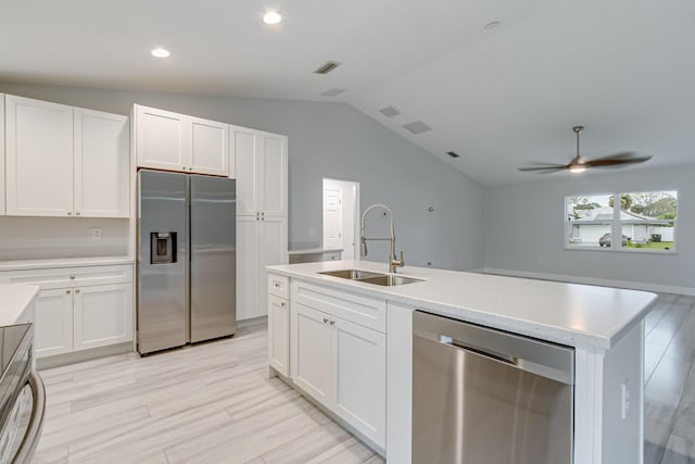 kitchen featuring sink, white cabinets, and stainless steel appliances