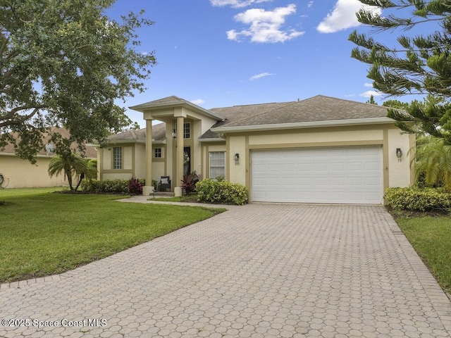 view of front facade featuring a garage and a front lawn