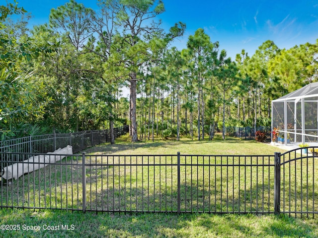 view of yard with a lanai