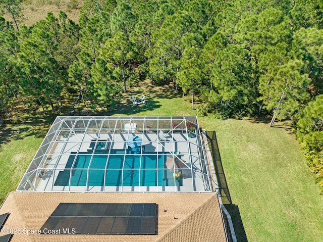 view of swimming pool with a lawn and tennis court