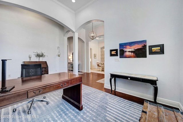 office area with hardwood / wood-style floors and crown molding