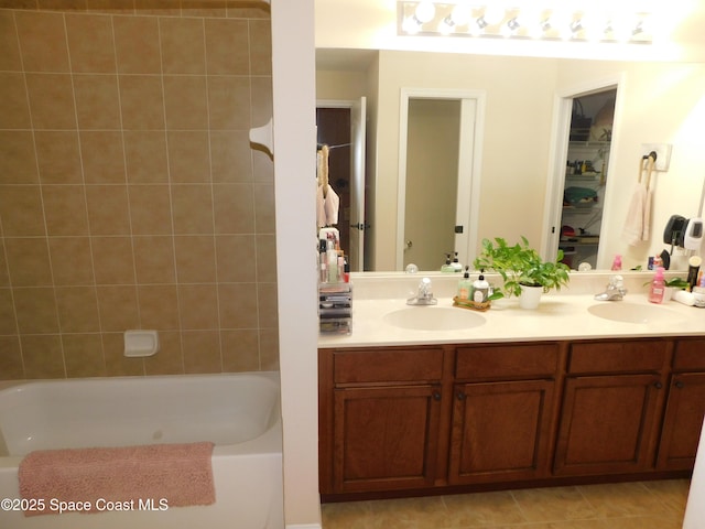 bathroom with vanity and tiled shower / bath combo