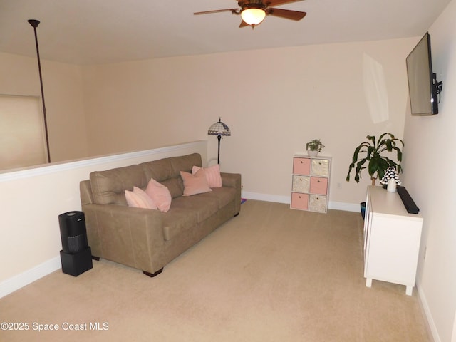 living room featuring light colored carpet and ceiling fan