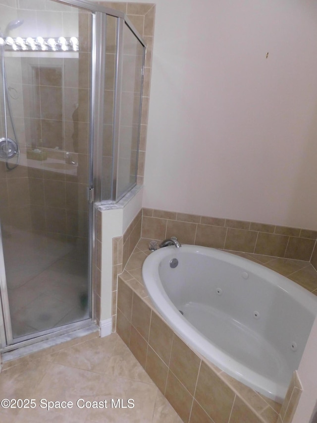 bathroom with tile patterned floors and separate shower and tub