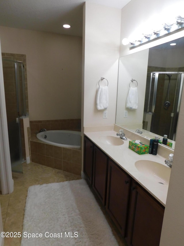 bathroom with vanity, plus walk in shower, and tile patterned flooring