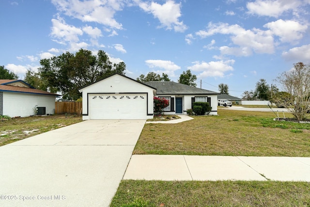 ranch-style home with central AC, a garage, and a front yard