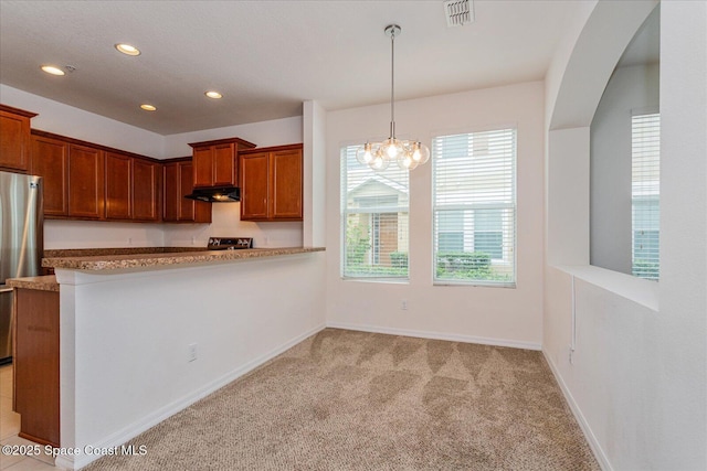 kitchen with a notable chandelier, hanging light fixtures, light colored carpet, kitchen peninsula, and stainless steel fridge