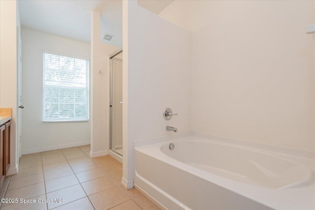 bathroom featuring vanity, separate shower and tub, and tile patterned flooring