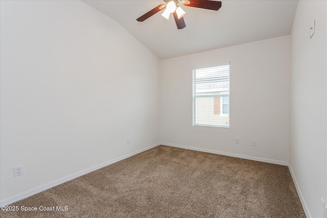 unfurnished room with ceiling fan, carpet floors, and lofted ceiling