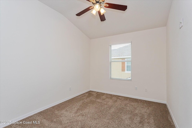 carpeted spare room with ceiling fan and lofted ceiling