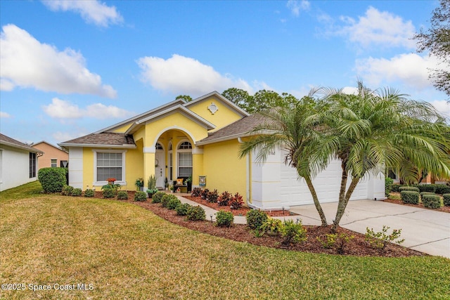 view of front of home featuring a garage and a front yard