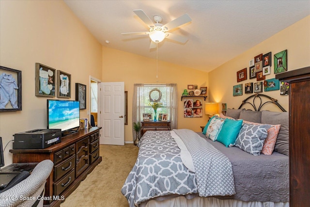 bedroom with ceiling fan, lofted ceiling, and light carpet