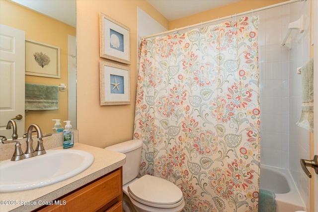 bathroom with toilet and vanity