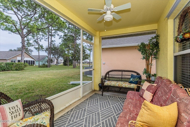 sunroom / solarium featuring ceiling fan