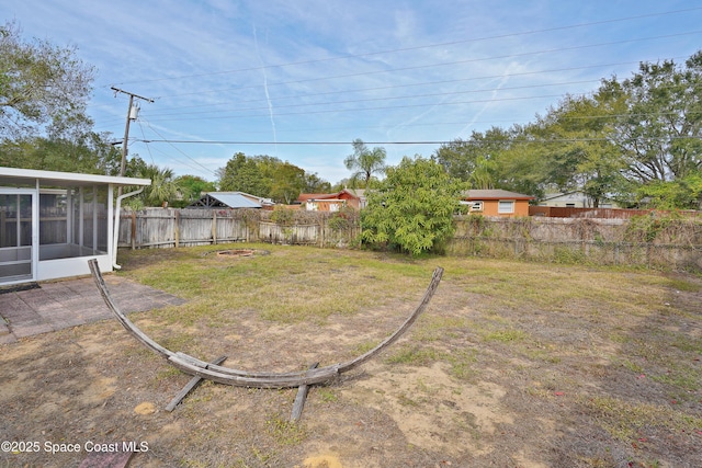 view of yard with a sunroom