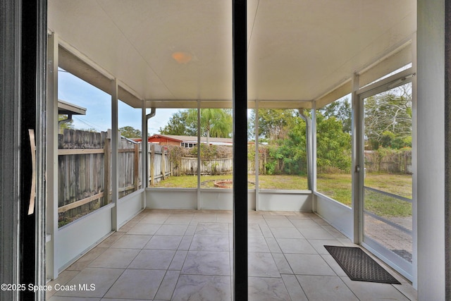 unfurnished sunroom with a wealth of natural light