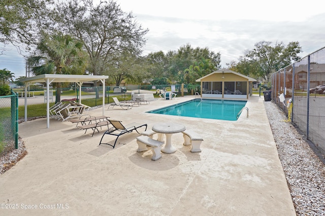 view of swimming pool with a patio