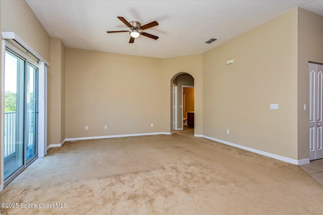 unfurnished room with ceiling fan and light carpet