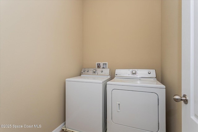 laundry room with washer and dryer