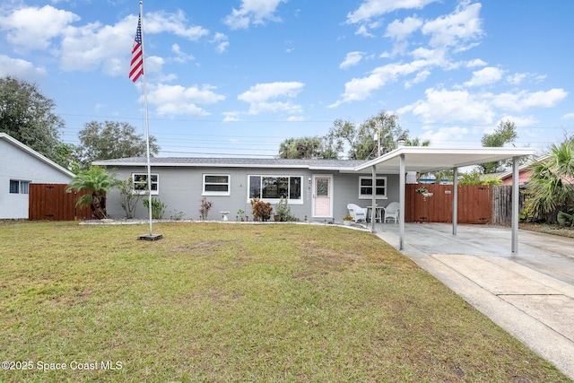 ranch-style house with a carport and a front lawn