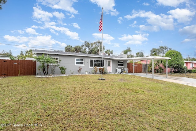 single story home with a front yard and a carport