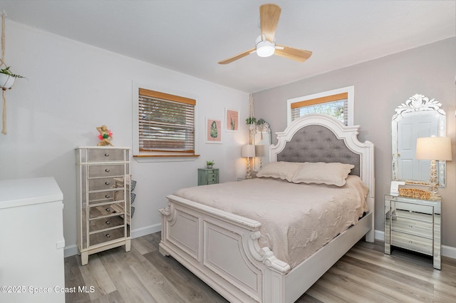 bedroom with light wood-type flooring and ceiling fan