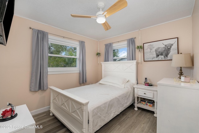 bedroom featuring dark wood-type flooring and ceiling fan