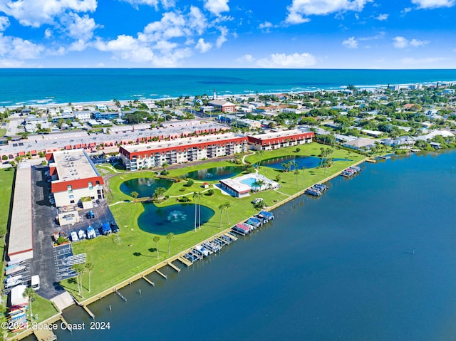 birds eye view of property featuring a water view