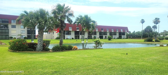 800 S Brevard Ave Unit 222, Cocoa Beach, FL 32931 - view of community featuring a water view and a yard
