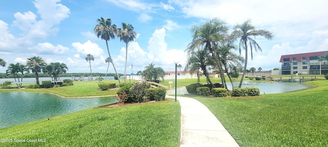 800 S Brevard Ave Unit 222, Cocoa Beach, FL 32931 - view of property's community with a water view and a lawn