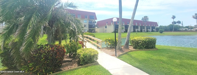 800 S Brevard Ave Unit 222, Cocoa Beach, FL 32931 - view of property's community with a lawn and a water view