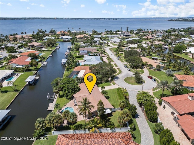 birds eye view of property featuring a water view