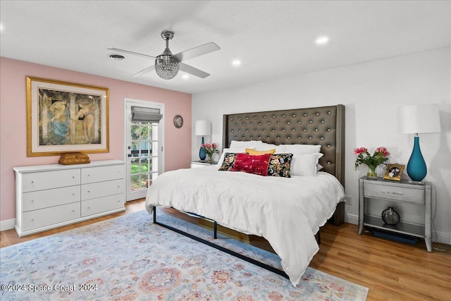 bedroom with access to outside, ceiling fan, and light wood-type flooring