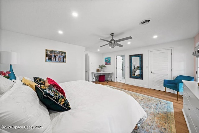 bedroom with ceiling fan and light hardwood / wood-style floors