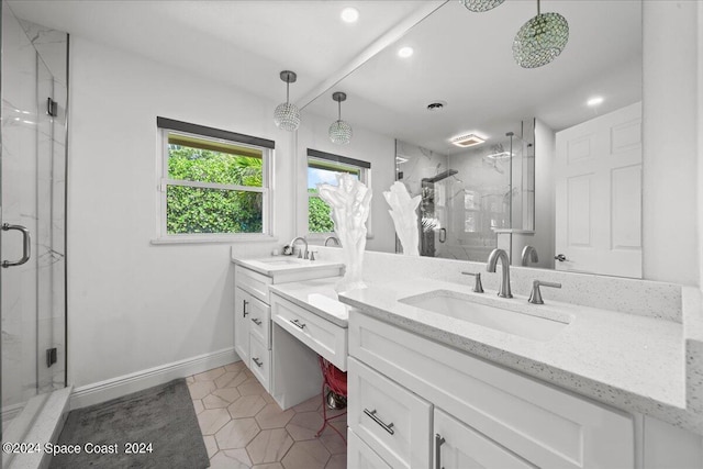 bathroom with tile patterned floors, vanity, and a shower with shower door