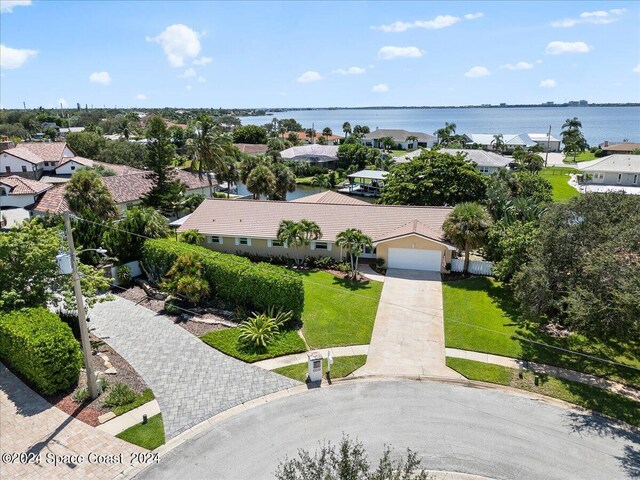 birds eye view of property featuring a water view