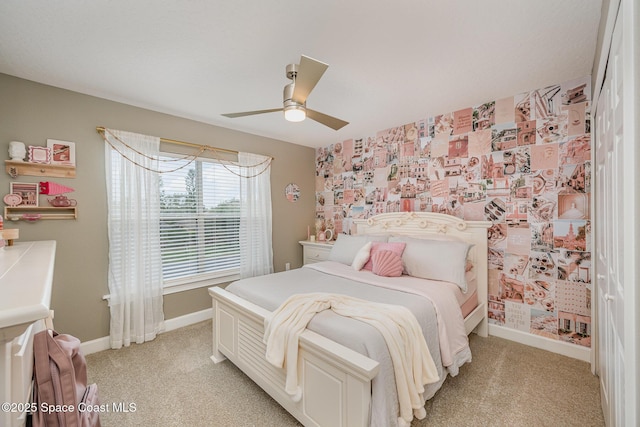 bedroom featuring ceiling fan and light carpet