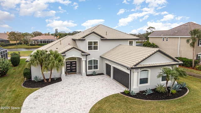 view of front facade featuring a garage, a front lawn, and french doors