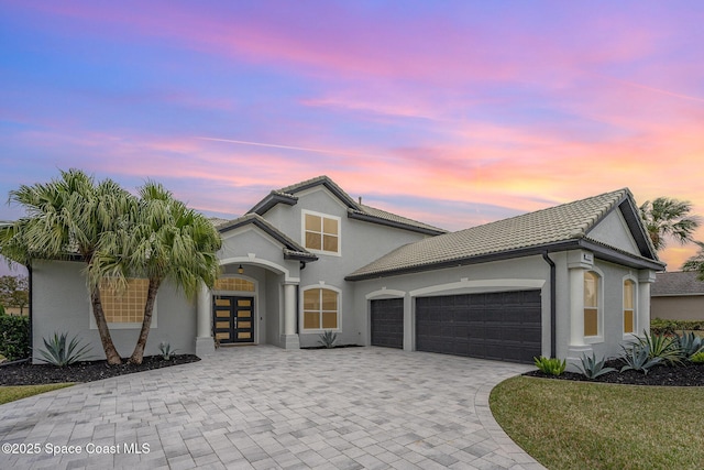 view of front of property with a garage