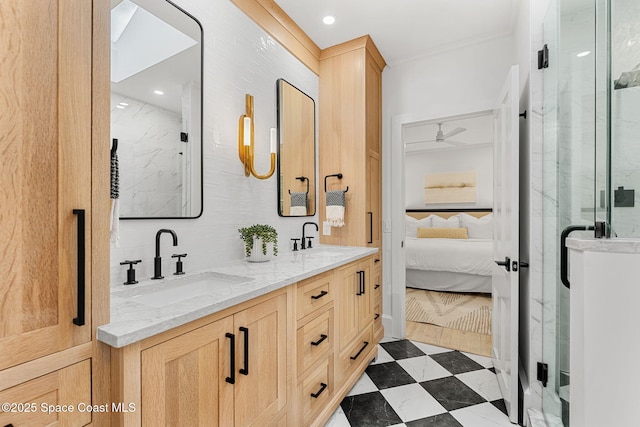 bathroom featuring vanity, crown molding, ceiling fan, and a shower with shower door