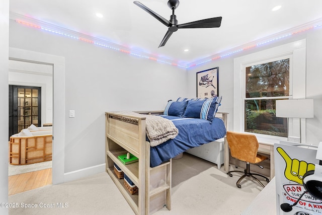 bedroom featuring crown molding, light carpet, and ceiling fan