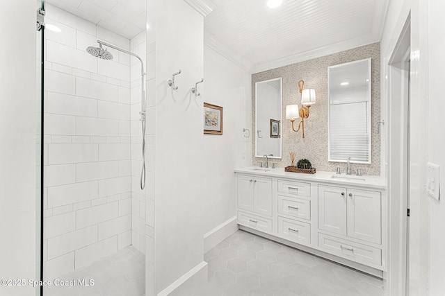 bathroom featuring tile patterned flooring, ornamental molding, a tile shower, and vanity