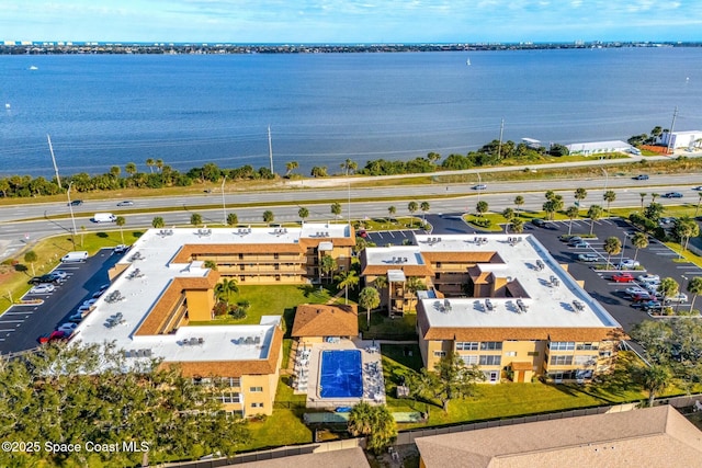 drone / aerial view with a water view