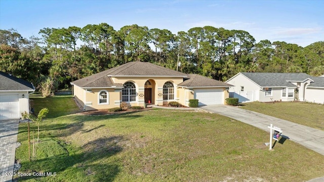 view of front of house with a garage and a front lawn